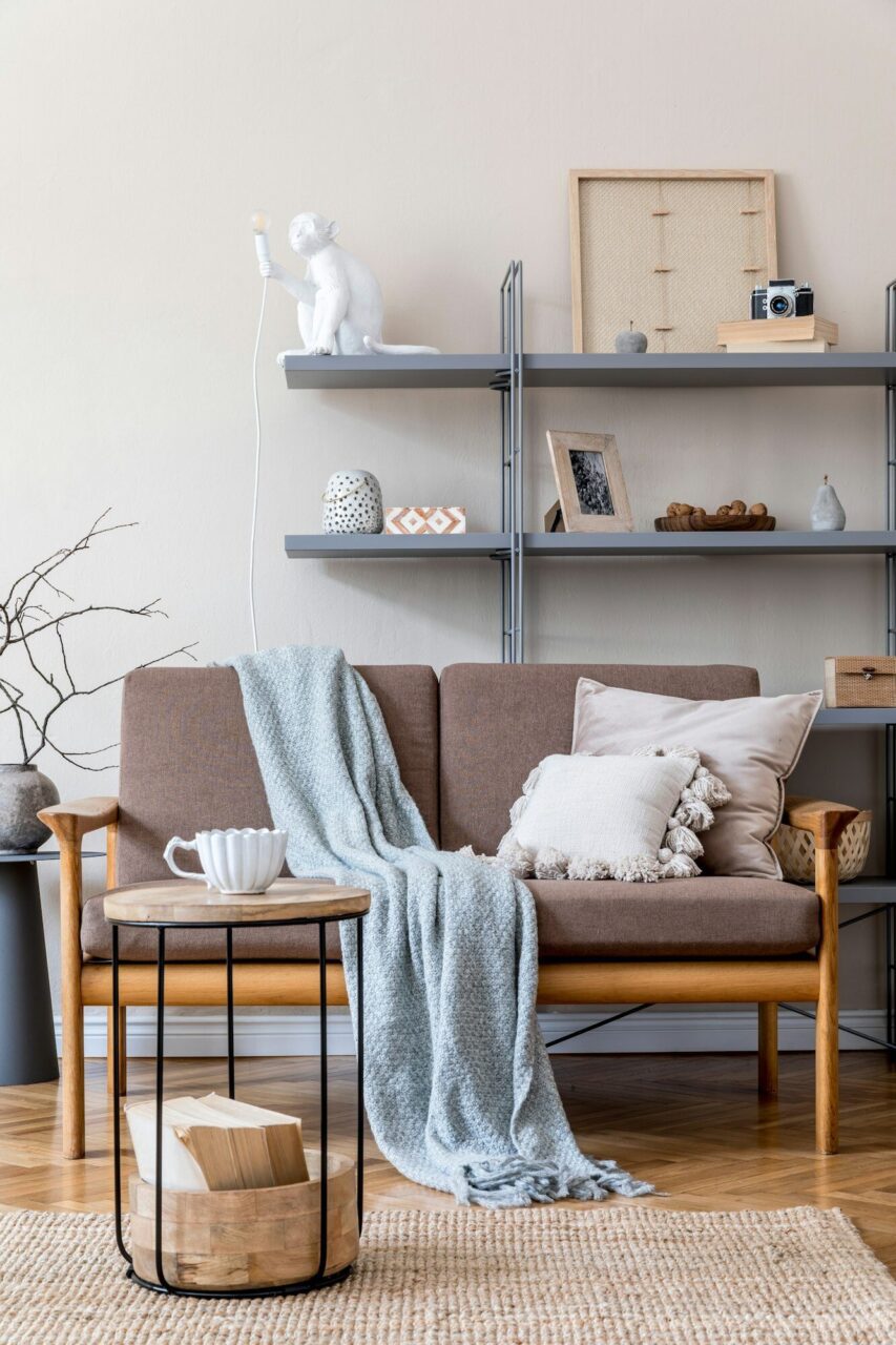 modern interior design of living room with brown wooden sofa grey bookstand .jpg